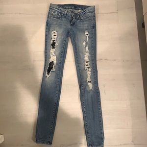 Bebe low rise lace ripped skinny jean